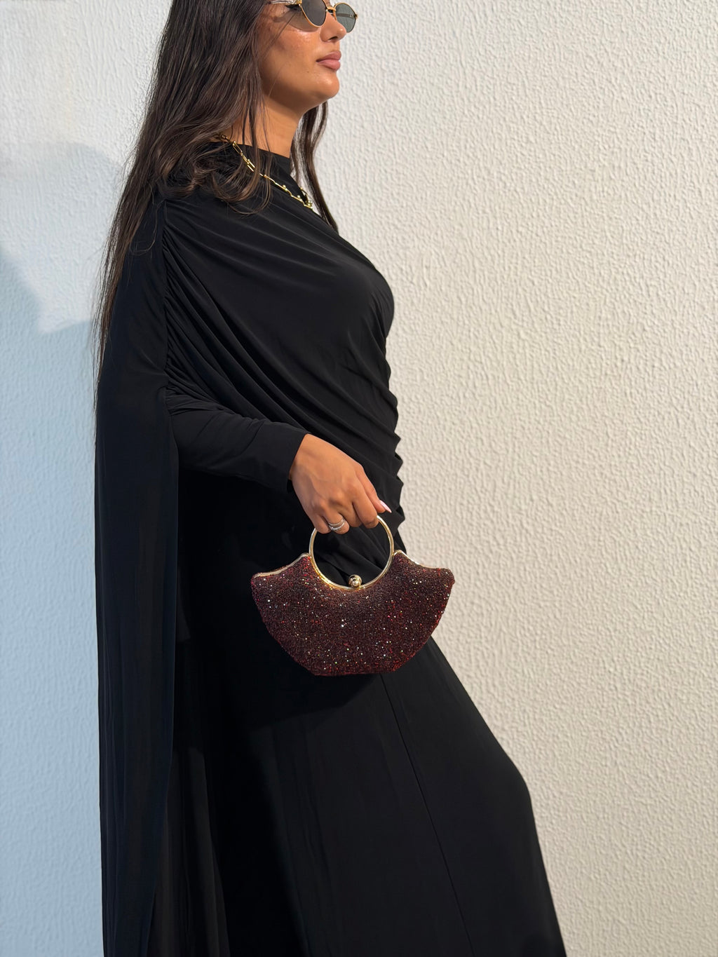 Black draped cape-sleeve gown