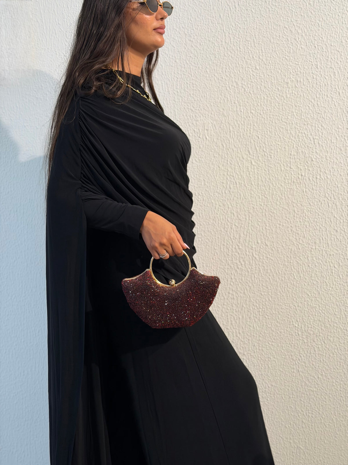 Black draped cape-sleeve gown