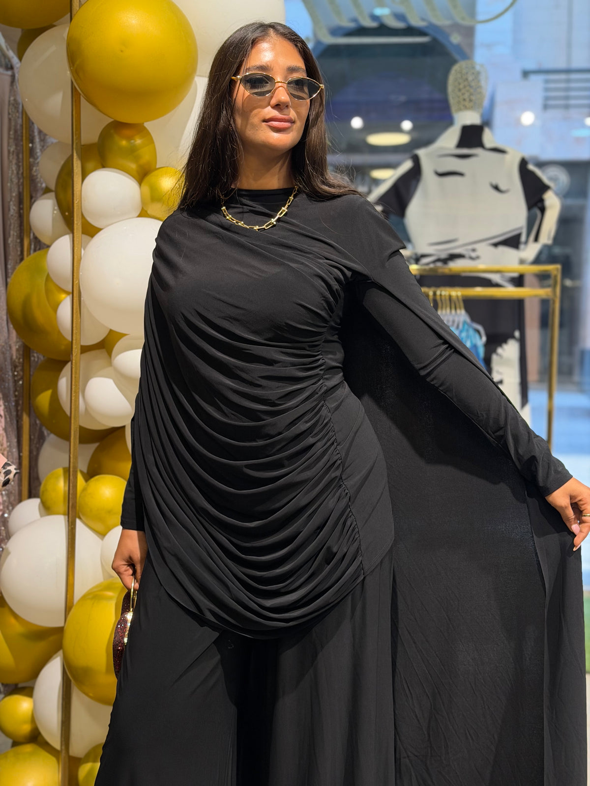 Black draped cape-sleeve gown