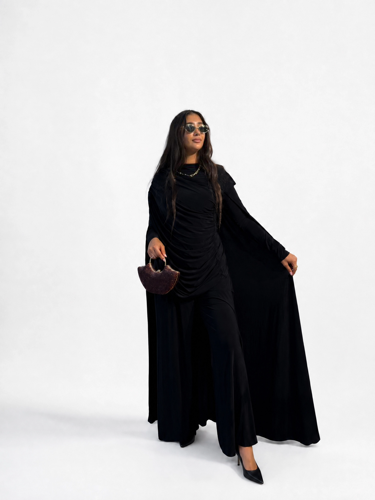 Black draped cape-sleeve gown